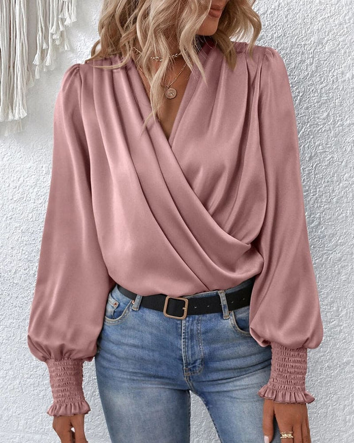 Classic women's long-sleeve wrap blouse. A versatile fashion top suitable for elegant office attire & casual chic outfits.