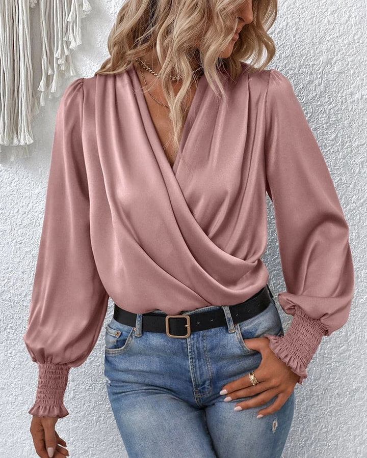 Modern women's elegant long-sleeve wrap blouse. A versatile fashion staple for both office and chic casual styling.