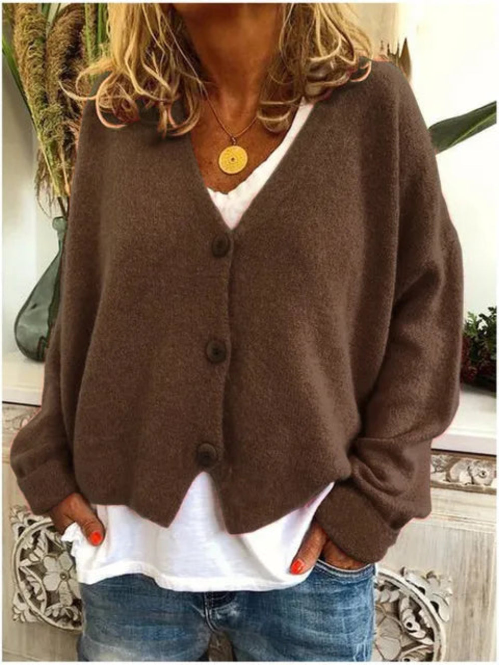 Casual women's V-neck knit cardigan, button-front style perfect for layering or as a light jacket.