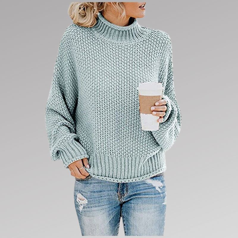 Soft women's knitted top with classic styling, offering warmth and comfort for cool weather fashion.