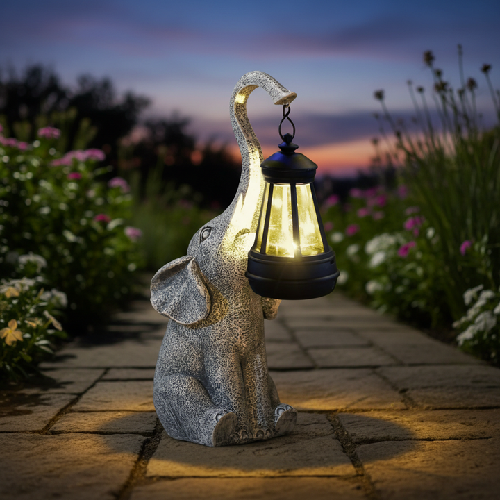 Whimsical solar elephant lamp for garden & patio decor. Automatic resin outdoor light, weatherproof for any yard.