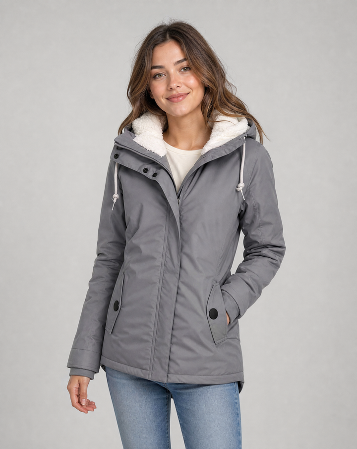 Stay dry in this women's waterproof rain jacket with hood, perfect for winter & outdoor adventures.