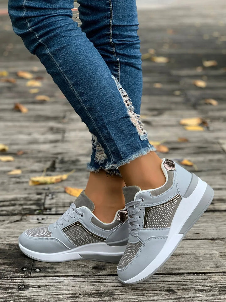 Dazzling women's platform sneakers, meticulously embellished with rhinestones for ultimate sparkle and comfort.