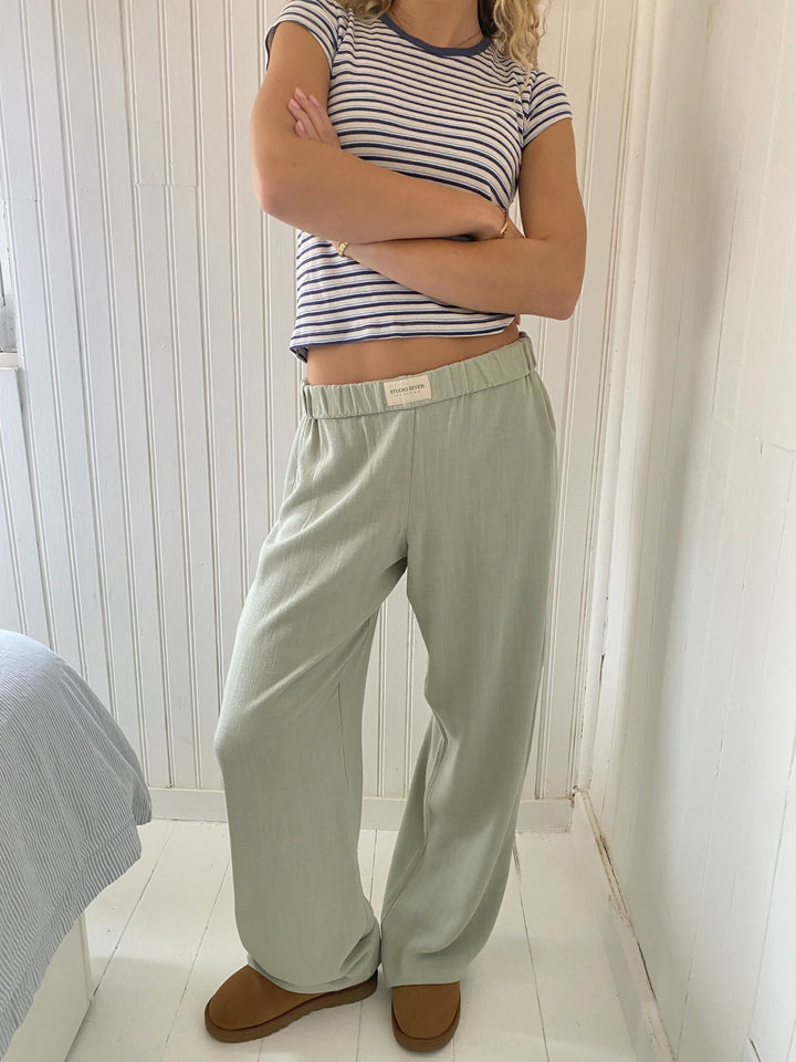 Side view of women's relaxed fit lounge pants, highlighting the relaxed silhouette & practical pockets.