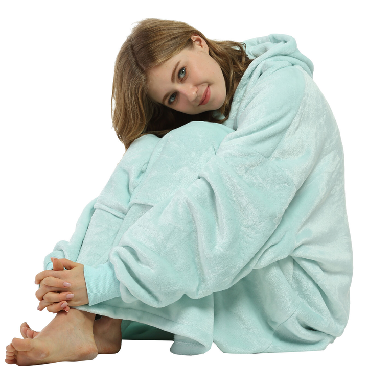 Oversized blanket hoodie in a stylish zebra print, providing both fashion and warmth for winter.