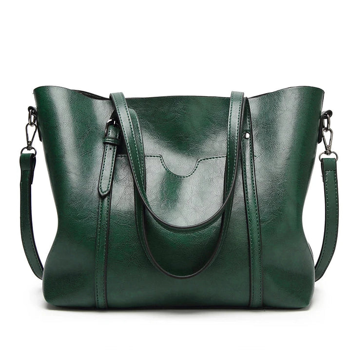 Front view of a sophisticated women's luxury leather handbag, perfect for any elegant occasion.