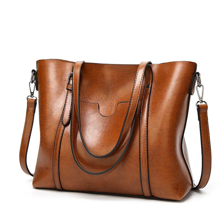 Black genuine leather luxury women's handbag, an elegant and versatile fashion accessory.