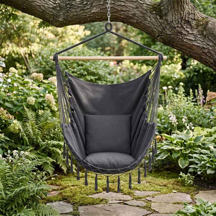 Bohemian canvas hanging hammock chair for indoor relaxation or outdoor comfort on a patio.