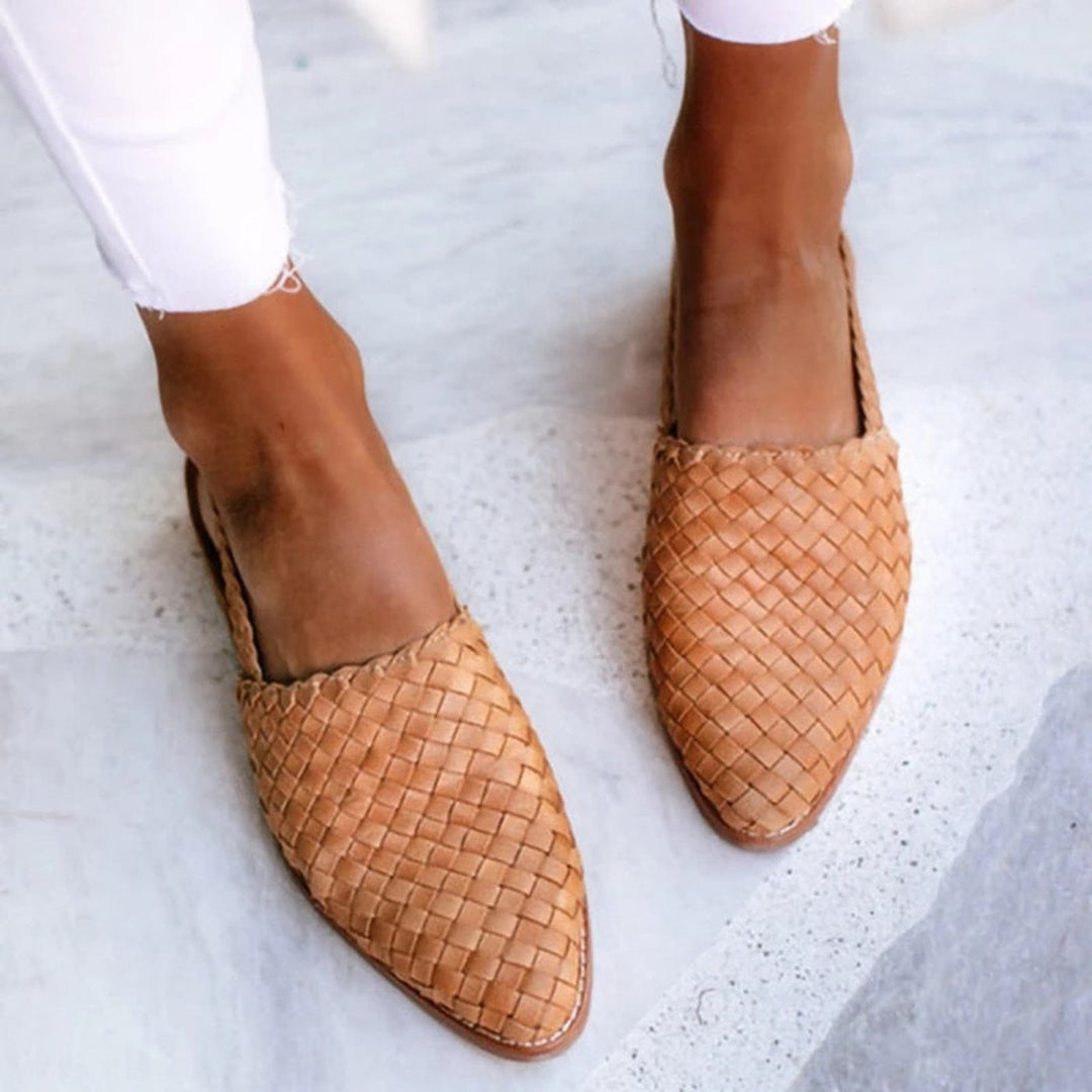 Comfortable women's flat slingback sandals with a pointed toe, ideal casual footwear for summer vacations.