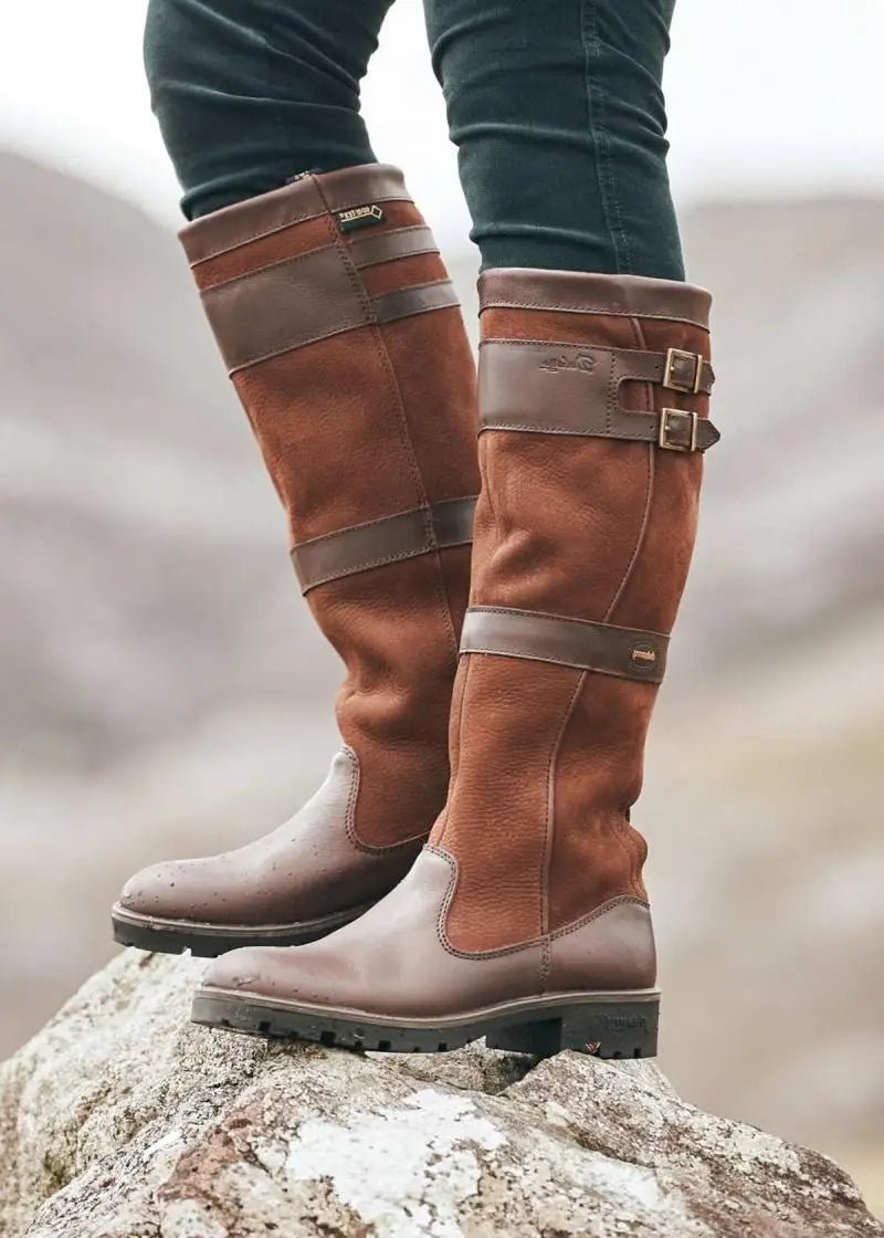 Comfortable women's pull-on knee-high boots. Waterproof design perfect for fall & winter, offering classic style.