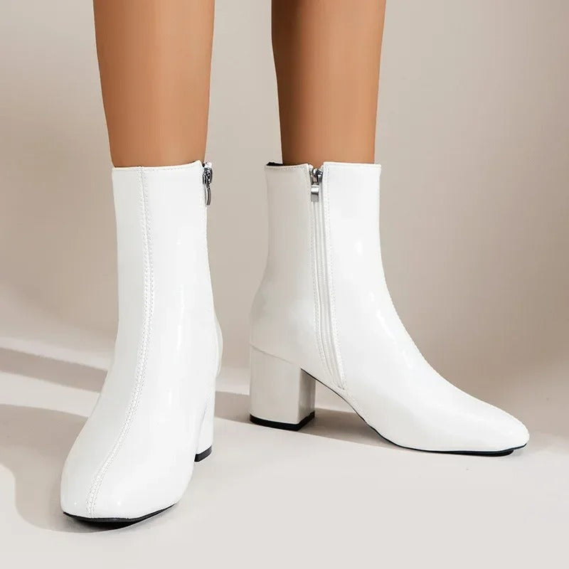 Stylish women's pointed toe ankle boots featuring a comfortable block heel for casual or formal wear.