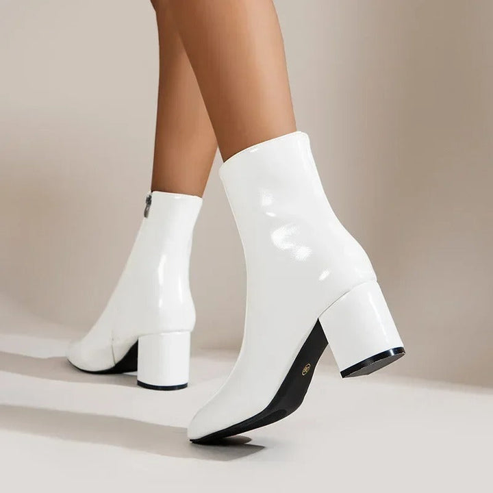 Modern women's booties with an elegant pointed toe and block heel, ideal for fashion-forward looks.