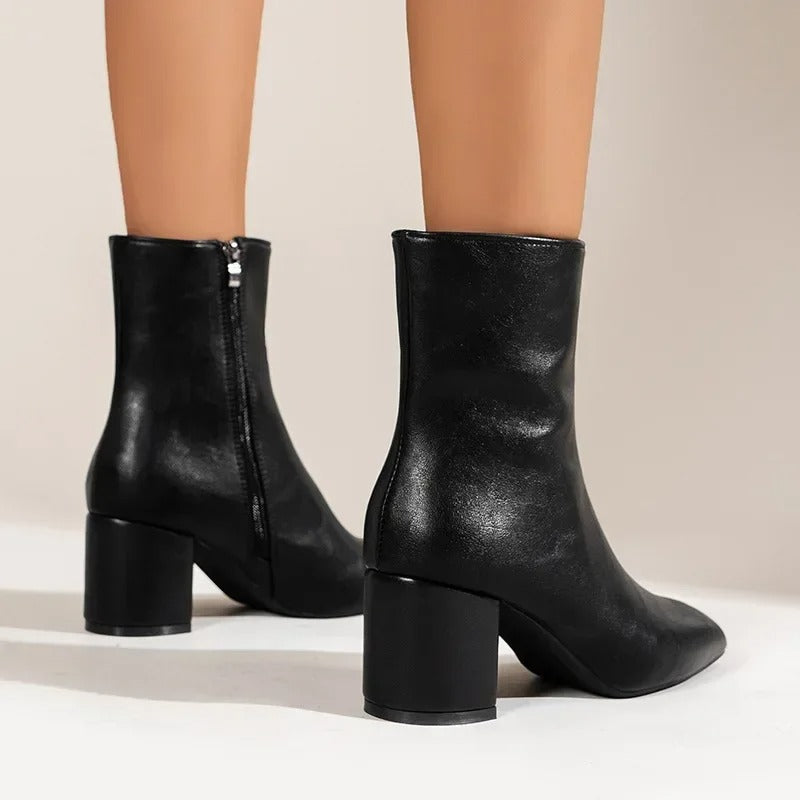 Women's fashion ankle boots, pointed toe and block heel, adding elegance and modernity to any outfit.