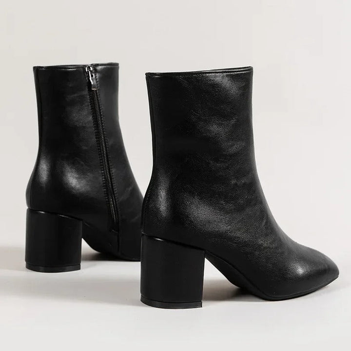 Elegant women's pointed toe ankle boots with a block heel, essential for stylish fall and winter fashion.