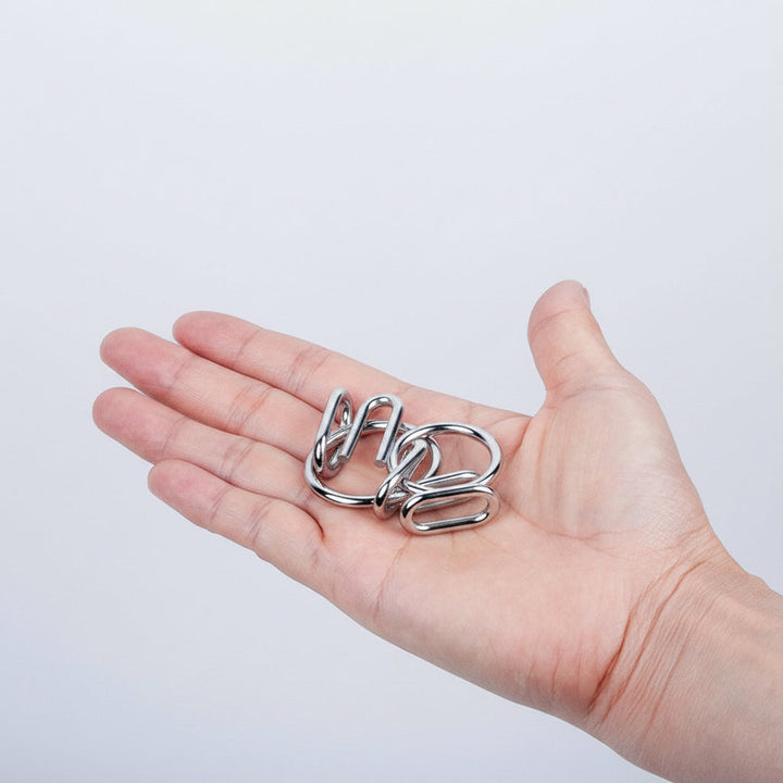 Kids' metal puzzle set: Engaging brain teasers & logic games. Educational toy for cognitive development & hands-on fun.