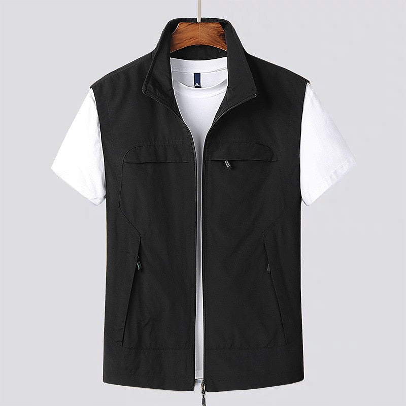 Versatile men's lightweight utility vest with zip front and stand collar, ideal for travel and outdoor activities.