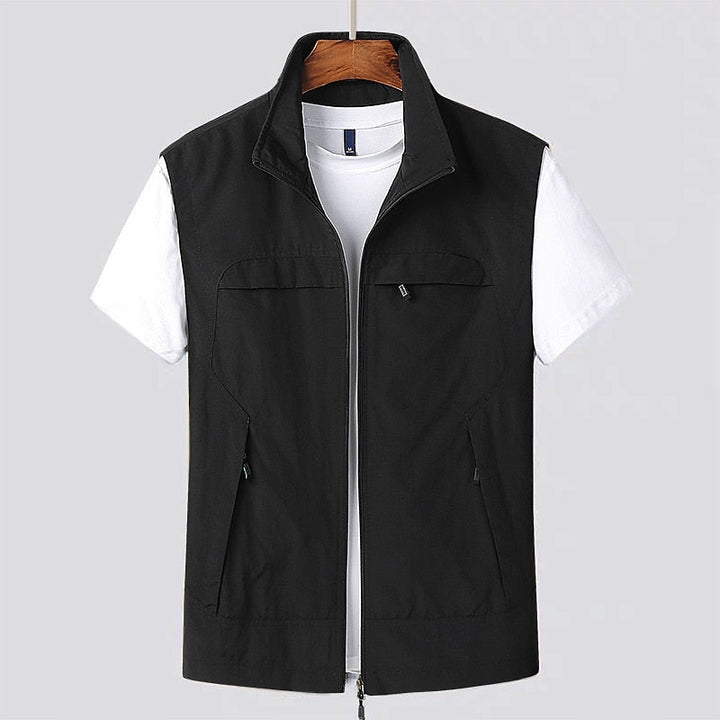 Versatile men's lightweight utility vest with zip front and stand collar, ideal for travel and outdoor activities.