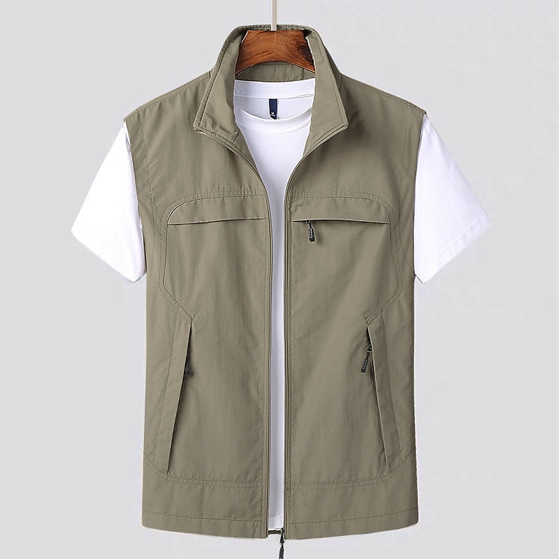 Stylish men's zip utility vest. Durable, lightweight and water-repellent, excellent for active outdoor adventures.