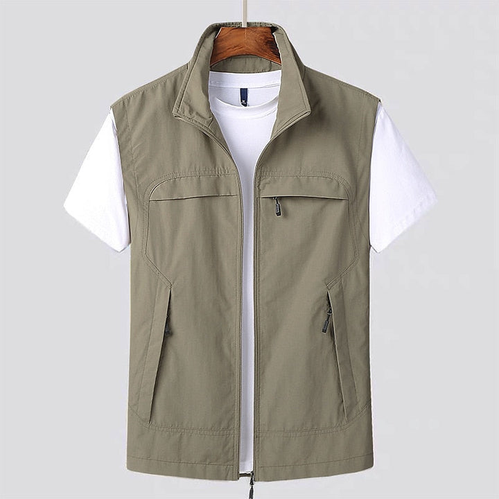 Stylish men's zip utility vest. Durable, lightweight and water-repellent, excellent for active outdoor adventures.