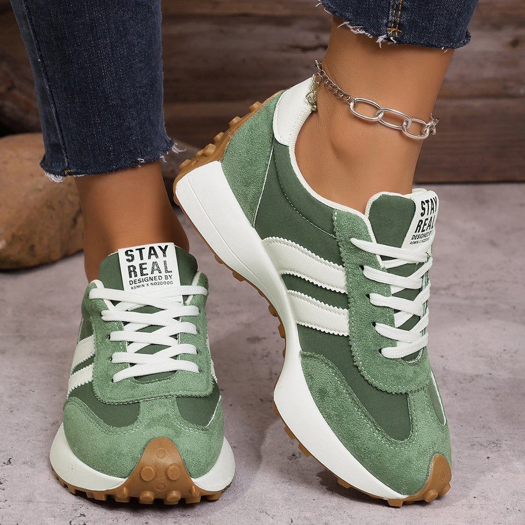 Cushioned women's wide fit sneakers, ideal for everyday comfort & support.