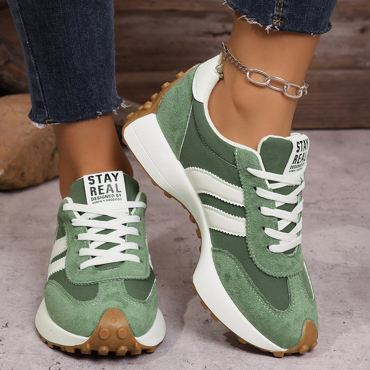 Cushioned women's wide fit sneakers, ideal for everyday comfort & support.