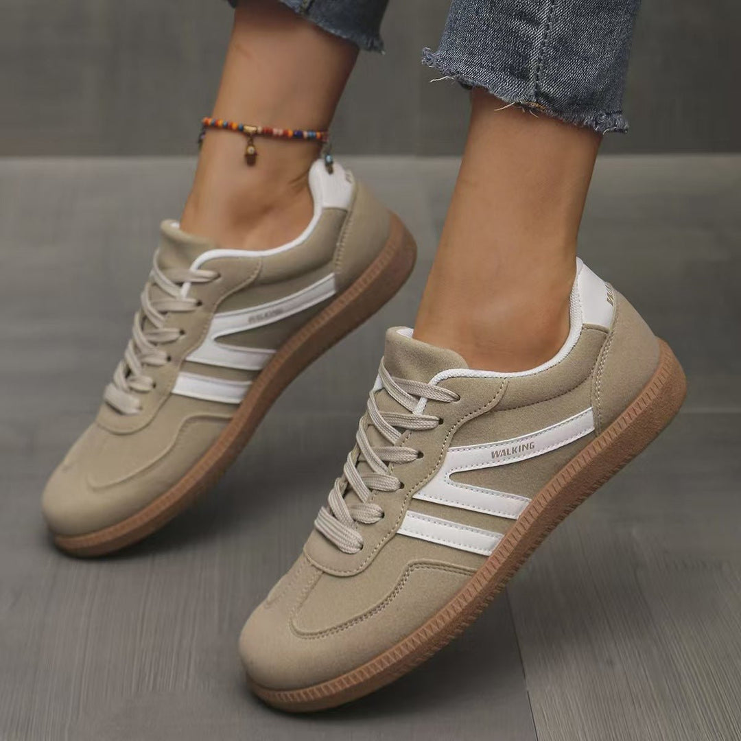 Women's lace-up walking trainers, offering wide fit and orthopedic comfort.