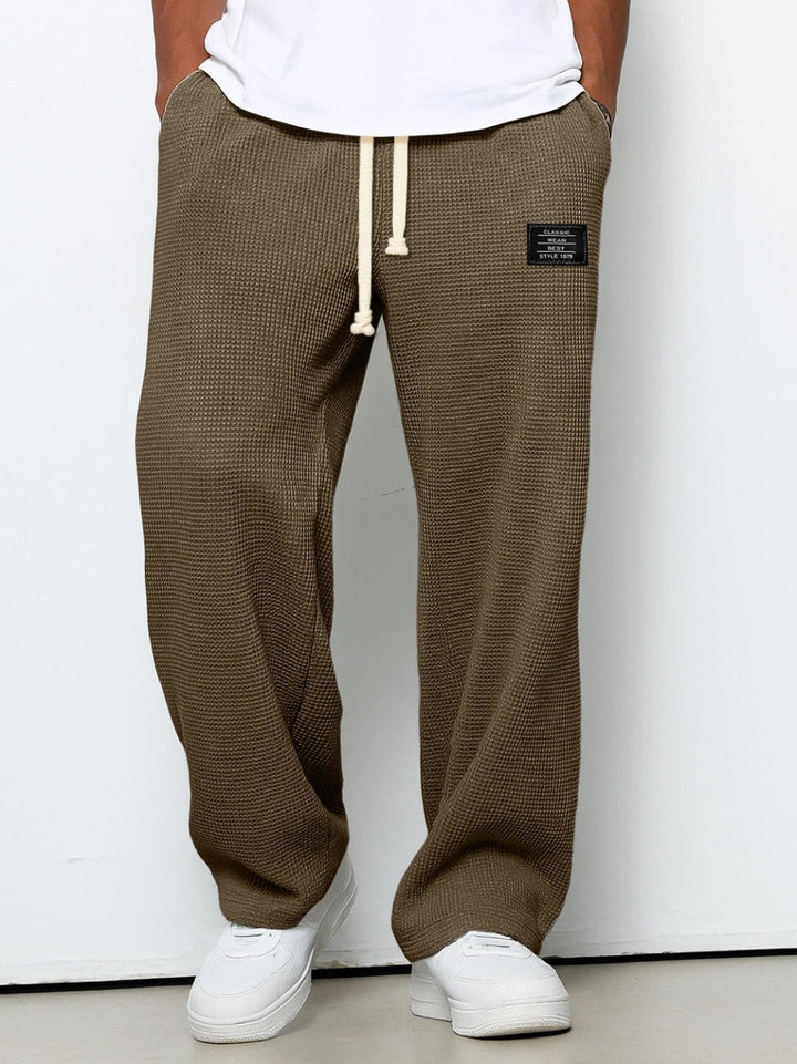 Waffle knit wide leg drawstring trousers for men, ideal as casual pants or loungewear.