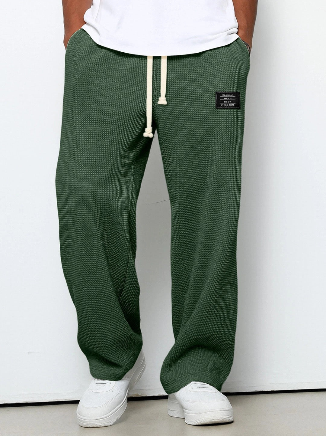 Stylish men's wide leg waffle knit trousers, suitable for home comfort or casual outings.