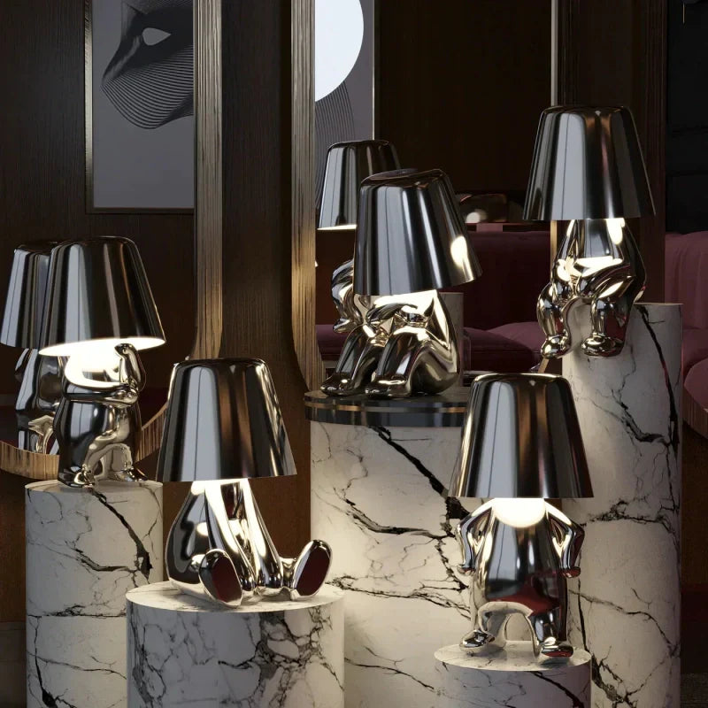 Dimmable LED figurine table lamp with touch control, creating ambient mood lighting for any room.