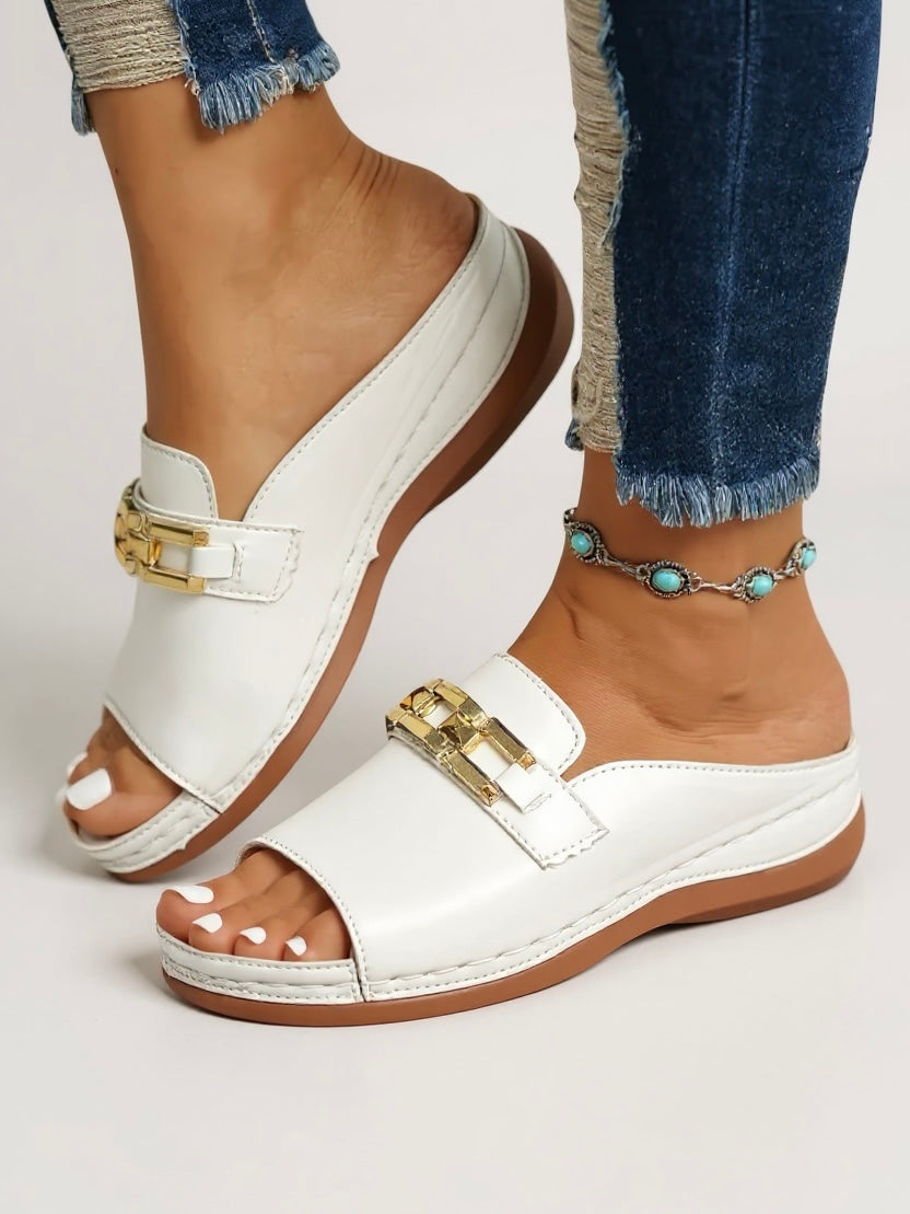 Pink women's slip-on sandals, cushioned minimalist design for comfortable casual summer style.