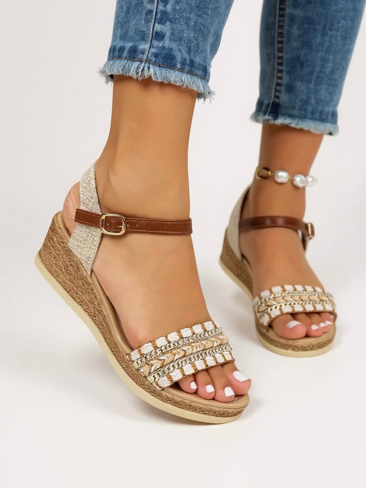 Elegant women's braided wedge sandals with comfortable heels, a perfect slip-on summer shoe for both casual and dressy looks.