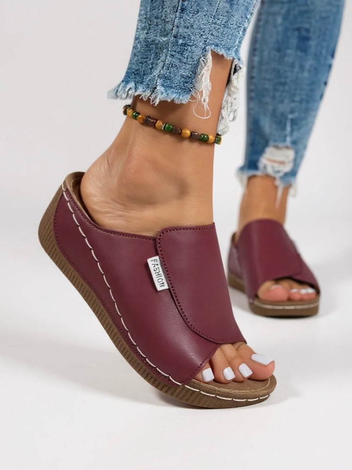 Effortless women's minimalist platform slides, the ultimate slip-on sandals for summer style.