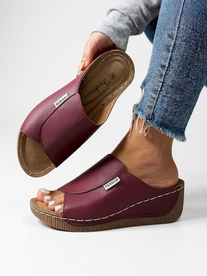 Close-up of women's minimalist platform slide sandal, showcasing quality for casual summer wear.