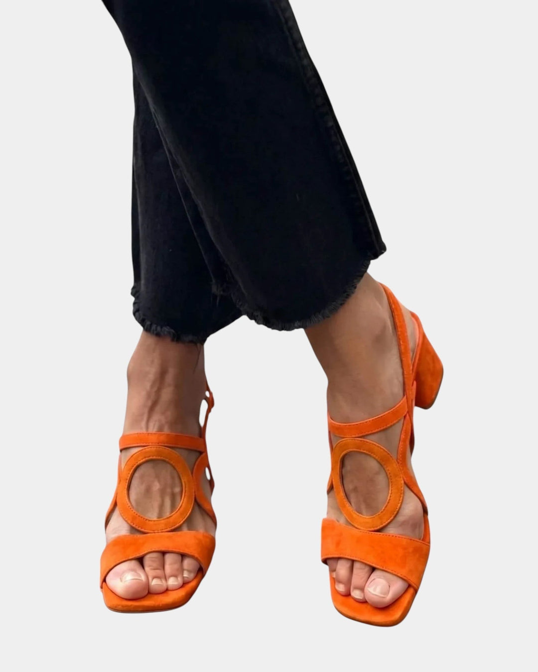 Fashionable women's block heel sandals in vibrant colors, featuring strappy design and comfortable support.