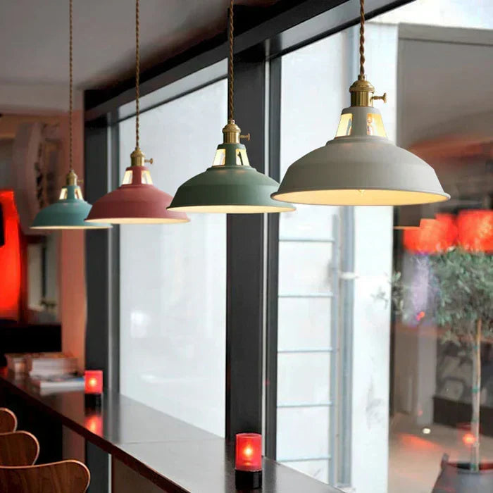 Durable black metal industrial hanging lamp, great for dining room or kitchen island lighting.