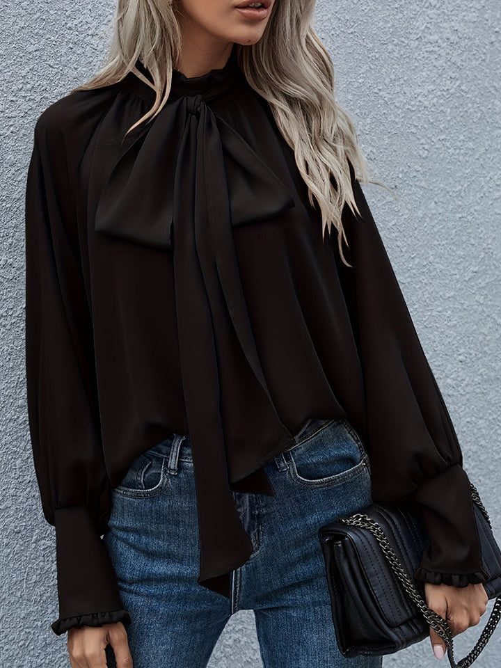 Women's fashion blouse with elegant long sleeves & chic tie-neck detail. Great for sophisticated work or casual wear.