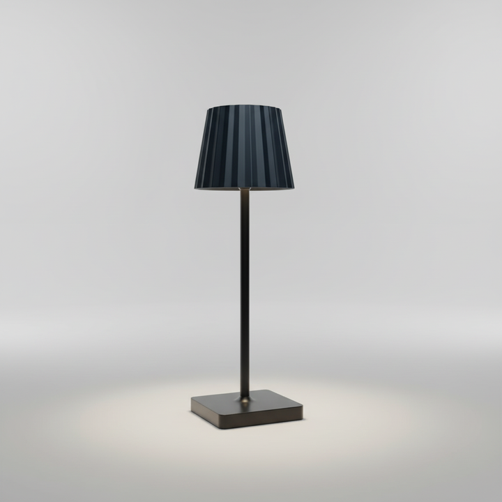Modern aluminum LED table lamp with a Scandinavian design. Wireless, battery-powered, and portable for any setting.