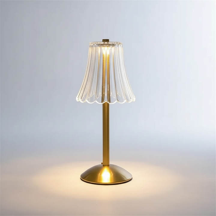 Rechargeable wireless LED table lamp, Champalight, offering portable ambient lighting for any room or outdoor space.