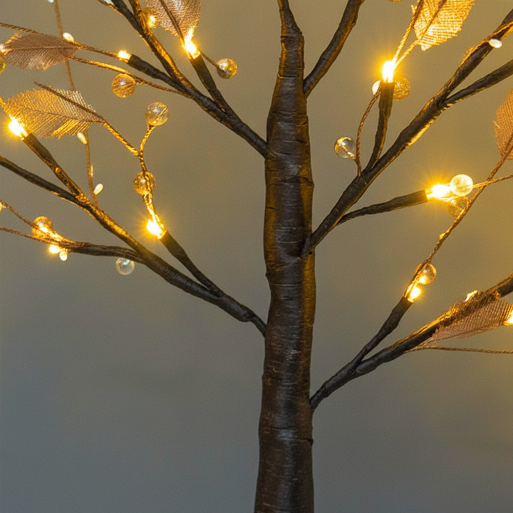 Portable wireless LED tree lamp, ideal as a battery-operated table lamp, creating a cozy mood light for indoor spaces.