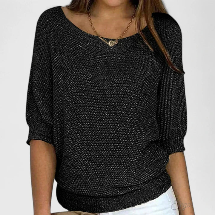 Soft women's long sleeve knit sweater, offering comfort, versatility, and an elegant look for any occasion.