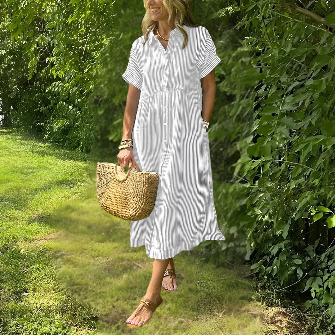 Elegant women's striped midi dress featuring vertical stripes and a flattering fit, great for casual winter style.