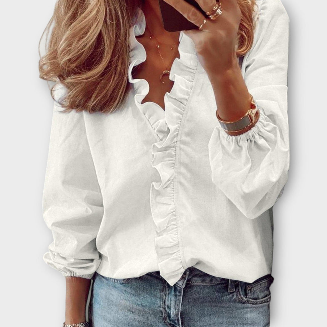 White Flora Ruffle V-Neck Long Sleeve Blouse for women. Elegant & versatile casual top, perfect for spring style.