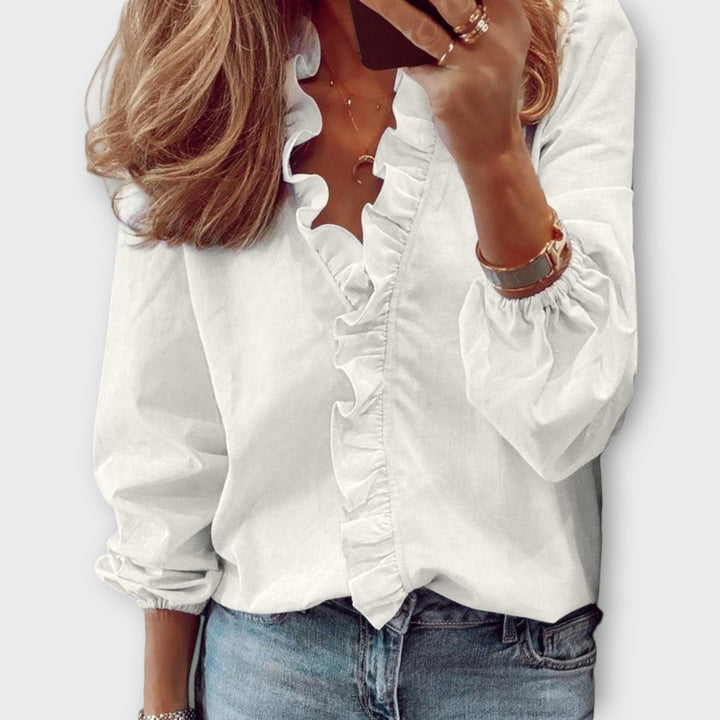 White Flora Ruffle V-Neck Long Sleeve Blouse for women. Elegant & versatile casual top, perfect for spring style.