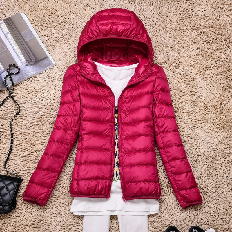 Warm women's packable puffer jacket with hood. Ultralight, ideal for casual everyday or winter travel.