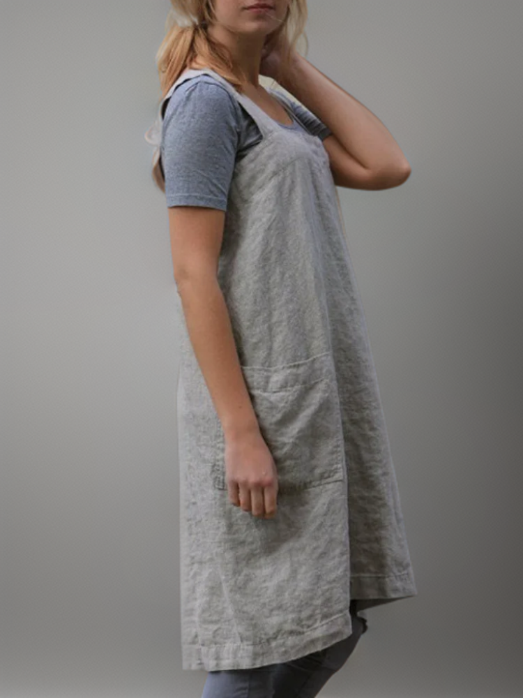 Stylish women's apron midi dress, versatile for creative workwear or daily tasks.