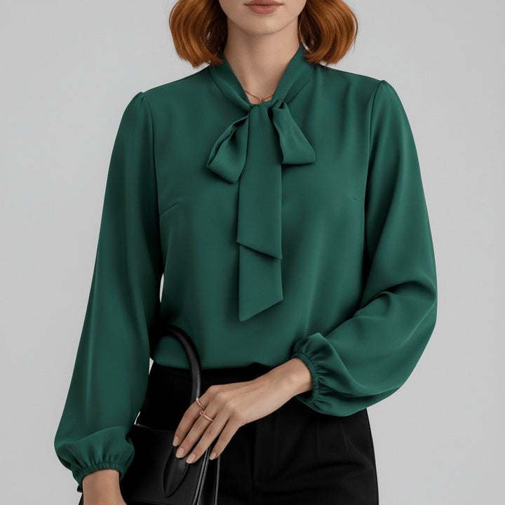 Fashionable women's bow-tie long-sleeve top. An elegant blouse for office or chic casual outfits.