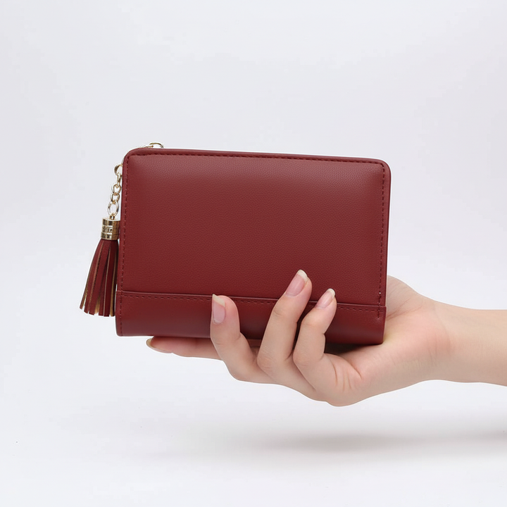 WalletFolio compact women's wallet held in hand, demonstrating its ergonomic and ladies' accessory size.