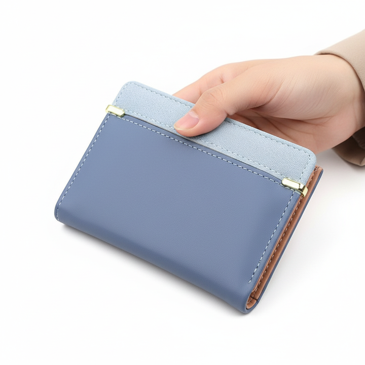 Front view of WalletFolio women's compact PU leather wallet in black, minimalist design.