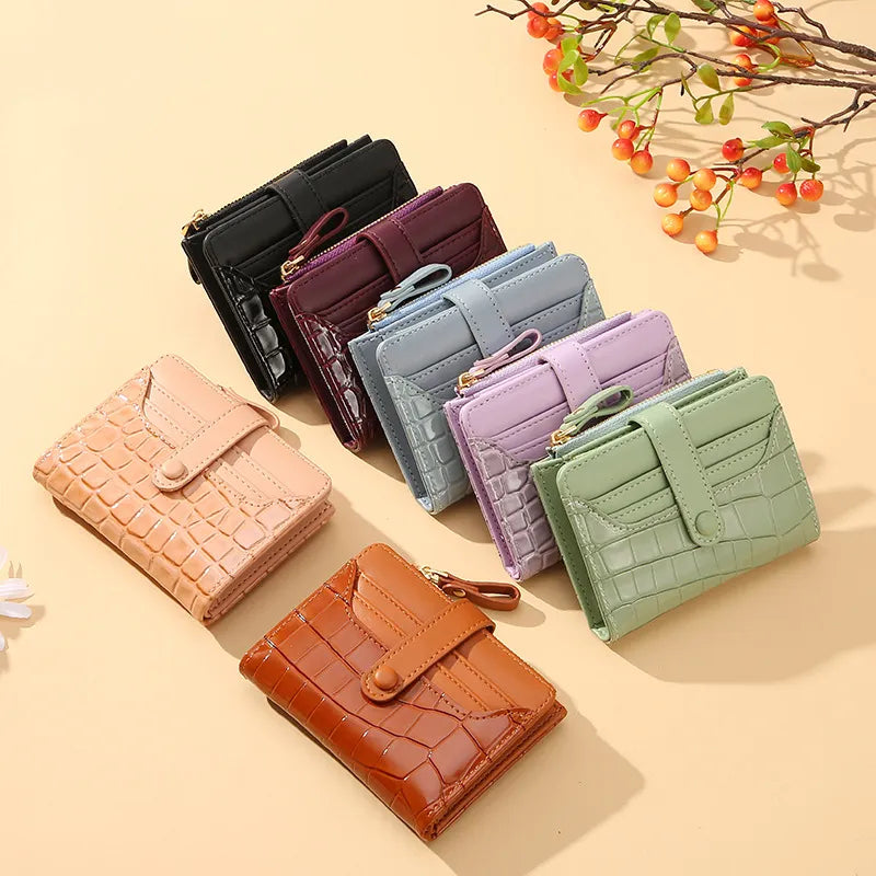 Luxury compact women's card holder wallet featuring a secure snap closure & sleek design.