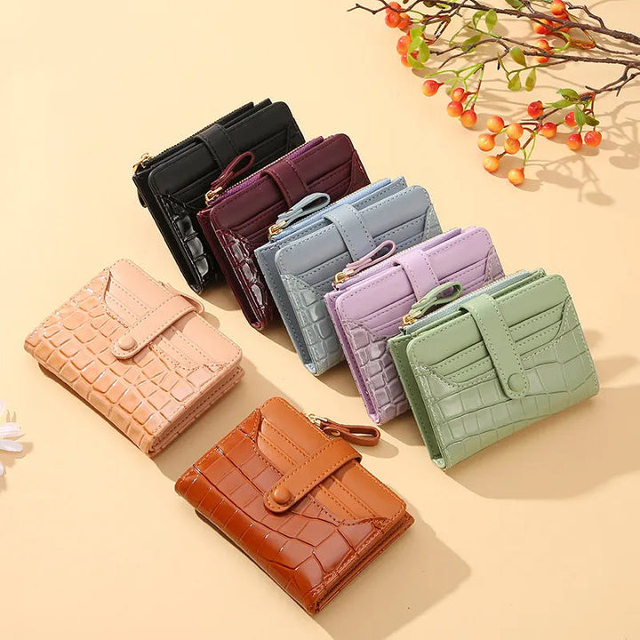 Luxury compact women's card holder wallet featuring a secure snap closure & sleek design.